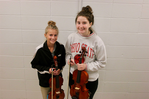 Sophomore Noel Zarnosky, left, and senior Taylor Jacobs qualified for the East Central Region Orchestra this November in Ashland.