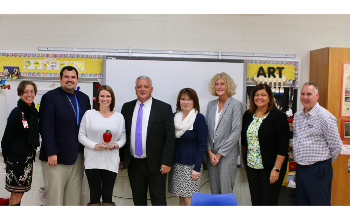 Amy Cox is pictured with district administrators