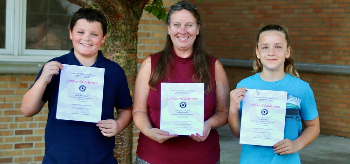 Pictured: Student Jayke Williamson, McGuffey Principal Cindy Baker and student Myra Hartings (not pictured: student Nellyanna Cooper) - the students were recognized for their Americanism Essays through the American Legion Auxiliary